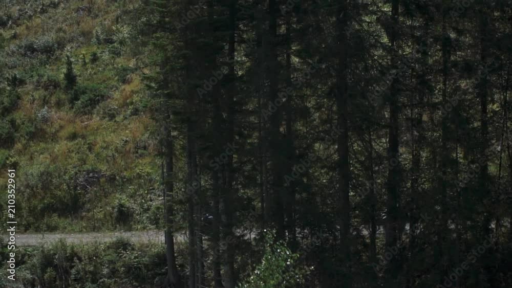 two enduro motorcyclists on an off-road dirt bike motorcycle rides on a road among the beautiful mountains, travel concept, slow motions two enduro motorcyclists on an off-road dirt bike motorcycle rides on a road among the beautiful mountains, travel concept, slow motions