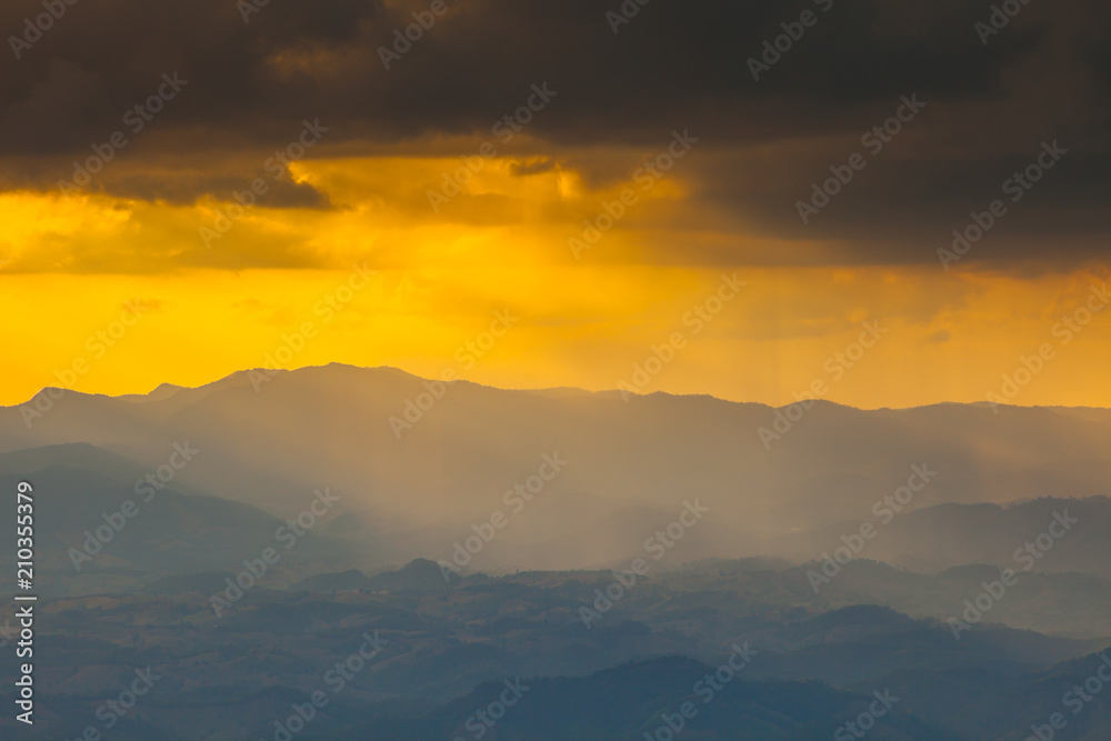 Colorful of sunset at mountain with cloudy on sky