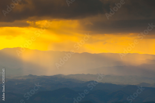 Colorful of sunset at mountain with cloudy on sky