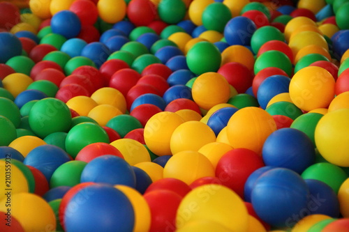 Children s party  toys     a lot of colorful plastic balls in a dry pool  red  green  blue  yellow.