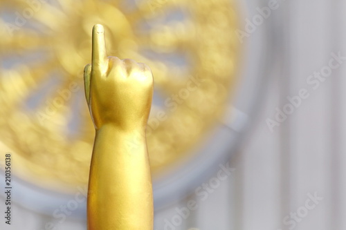Fototapeta Arms and index fingers of Buddha child, baby Buddha gold statue, Buddha golden