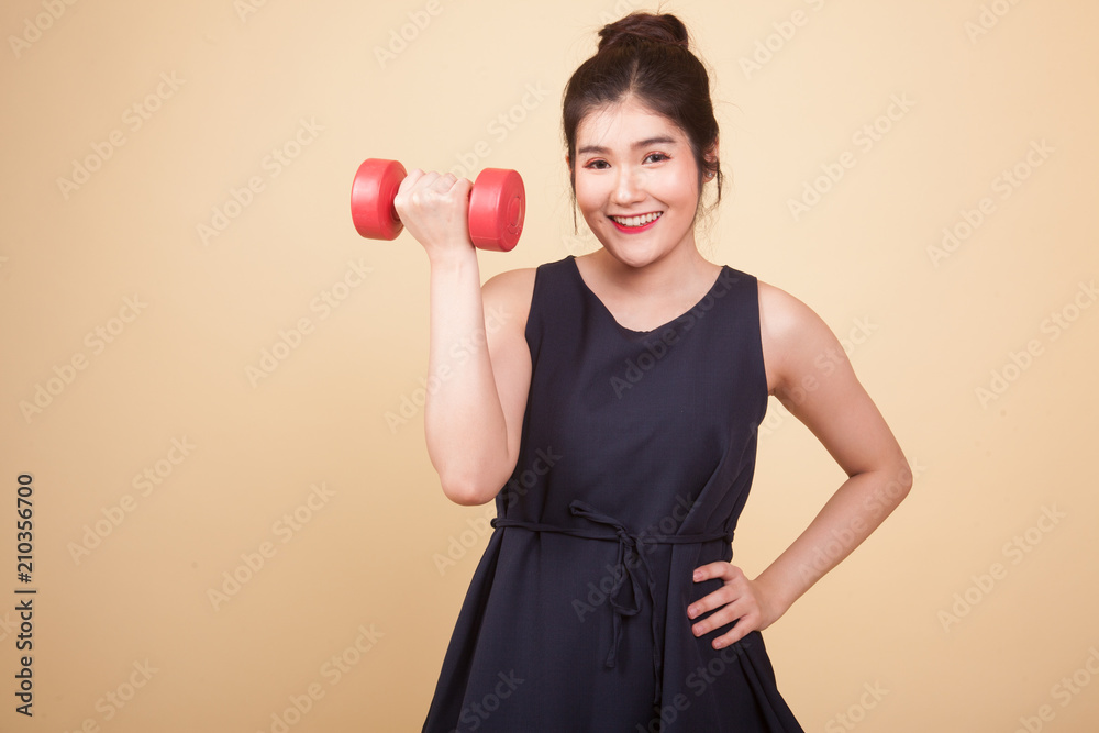 Healthy Asian woman with dumbbells. Healthy Asian woman with dumbbells.