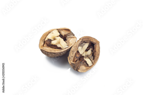 broken walnuts on white background
