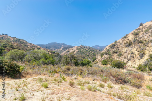 Hiking trails in Southern California mountains on hot summer afternoon in bright sunshine