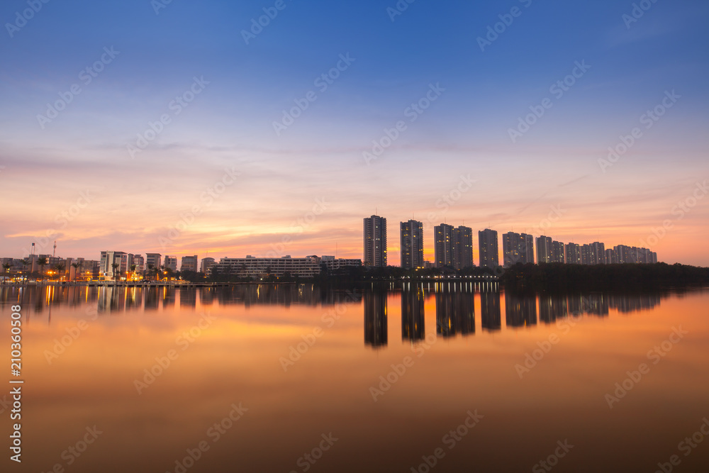 Reflection of condominium on water surface at sunset timing located at impact arina Bangkok Thailand  