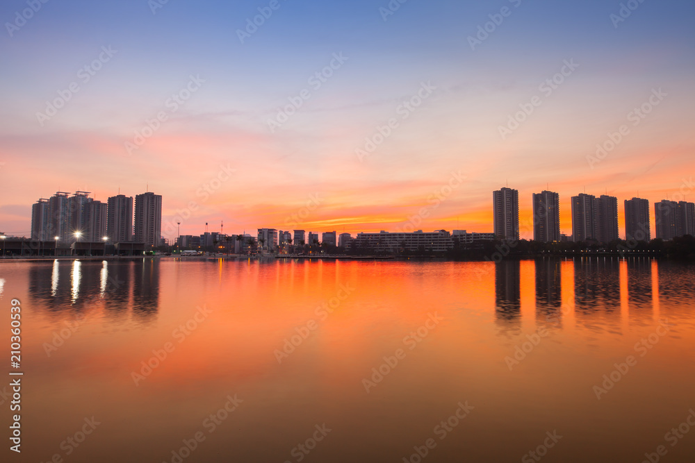 Reflection of condominium on water surface at sunset timing located at impact arina Bangkok Thailand  