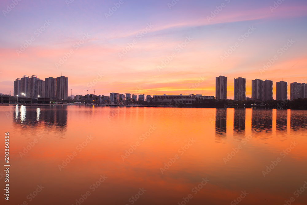 Reflection of condominium on water surface at sunset timing located at impact arina Bangkok Thailand  