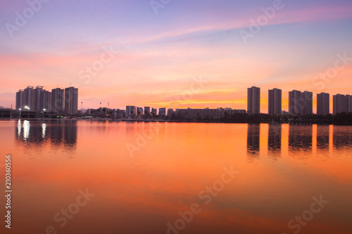 Reflection of condominium on water surface at sunset timing located at impact arina Bangkok Thailand   © pattierstock