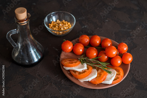 Mozzarella, cherry tomatoes and basil.Caprese salad photo