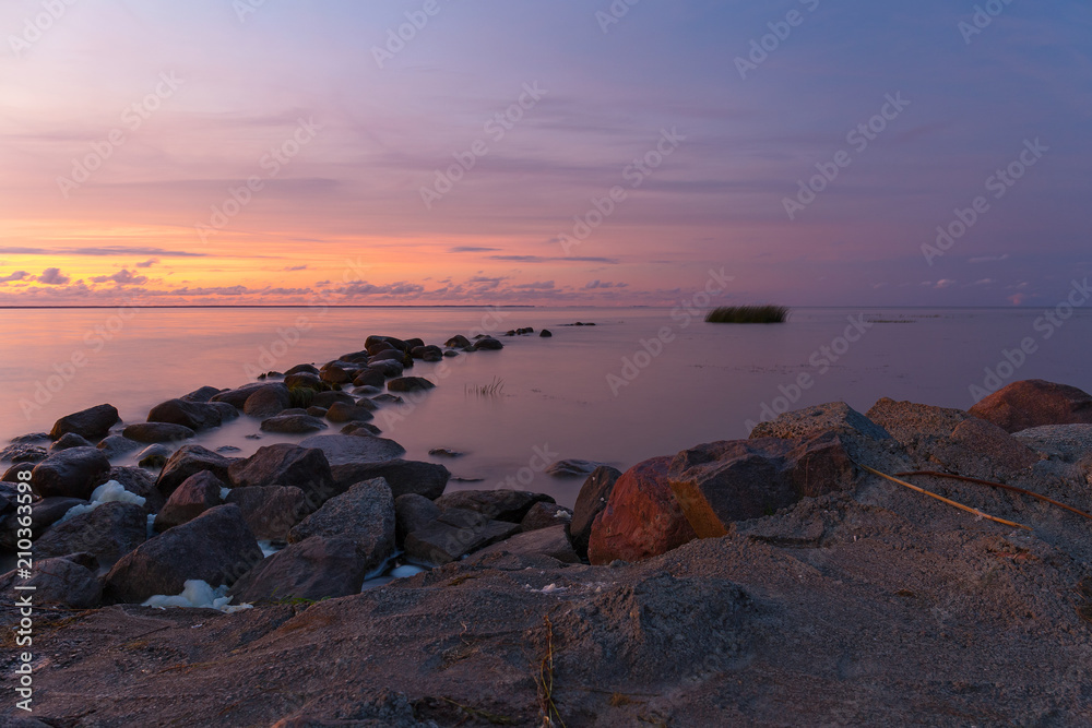 Rocky shore of the sea bay in the quiet evening