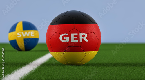 Germany vs. Sweden Soccer Match - Soccer balls in German and Swedens national colors on a soccer field. Copy space on the right side - 3D Rendering 
