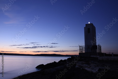Dark lighthouse during summer solstice
