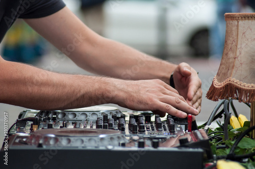 closeup of hands of mixer at dance floor in outdoor