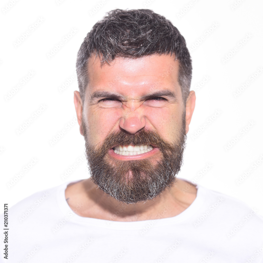 Obraz premium Angry man. Anger. Aggressive bearded man with stylish hair. Hipster with long beard and mustache with very angry and furious expression. Feeling and emotions. Man mad angry emotional portrait. Closeup
