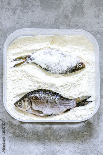Peeled fish in flour