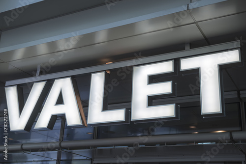 Closeup of Valet parking - stop here sign.
