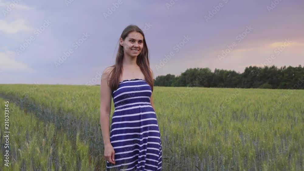 girl going cross the wheat field at sunset. girl going cross the wheat field at sunset.