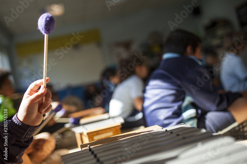 girl playing xylophone