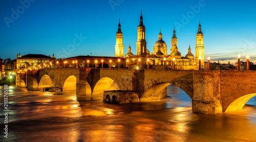 Zaragoza city, Spain, bridge and Cathedral del Pilar at sunset