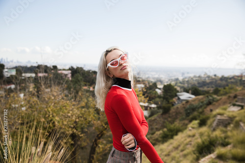 Woman wearing sunglasses posing