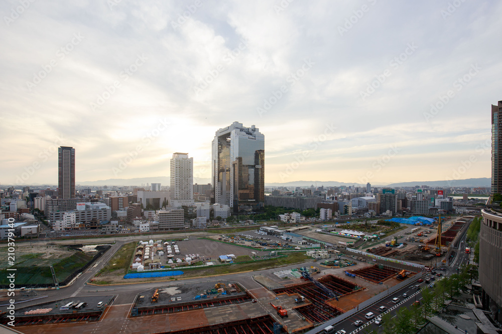 Obraz premium Osaka, Japan - June 22, 2018: View from roof of Osaka Station over construction site