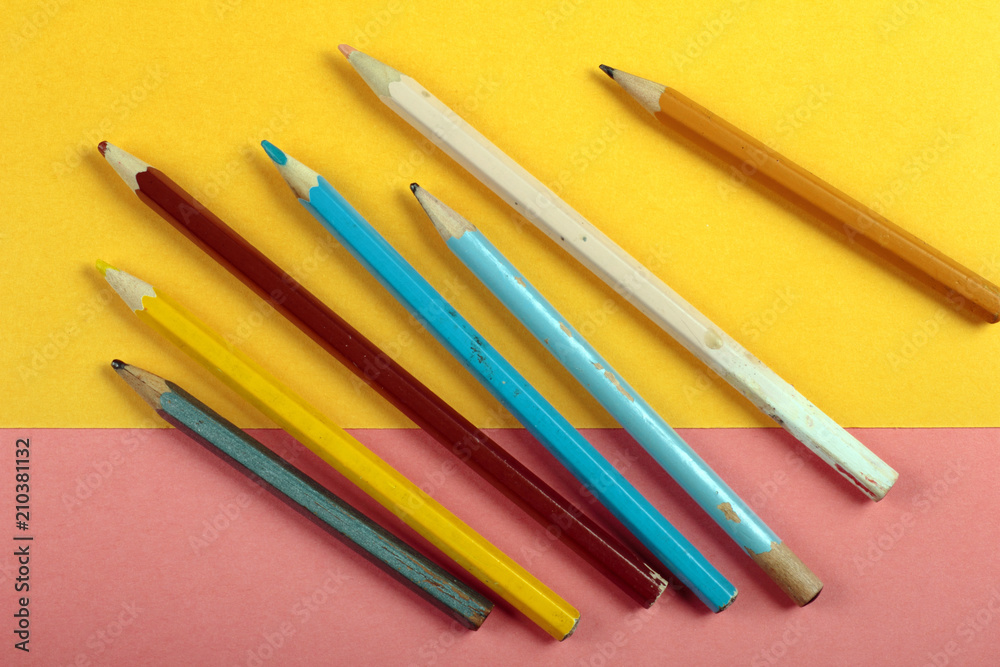 Summer fun minimal concept. Top view on pencil colors. Drawing. Pastel colours background. Flat lay, mock up and copy space. Trendy colors.