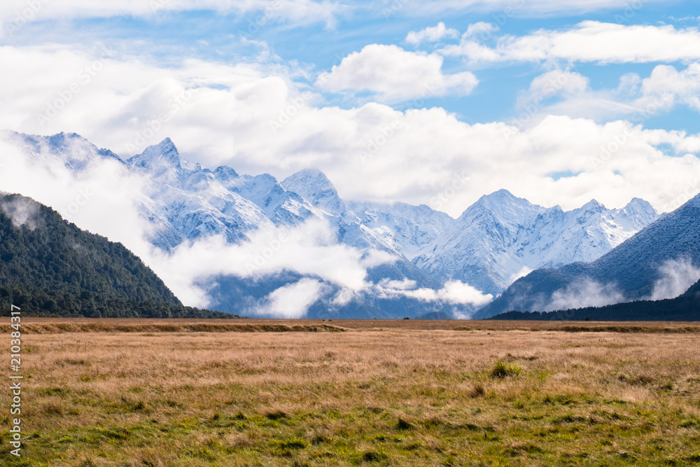 The stunning scene of grassland and alps at Eglinton Valley on the road to Milford Sound