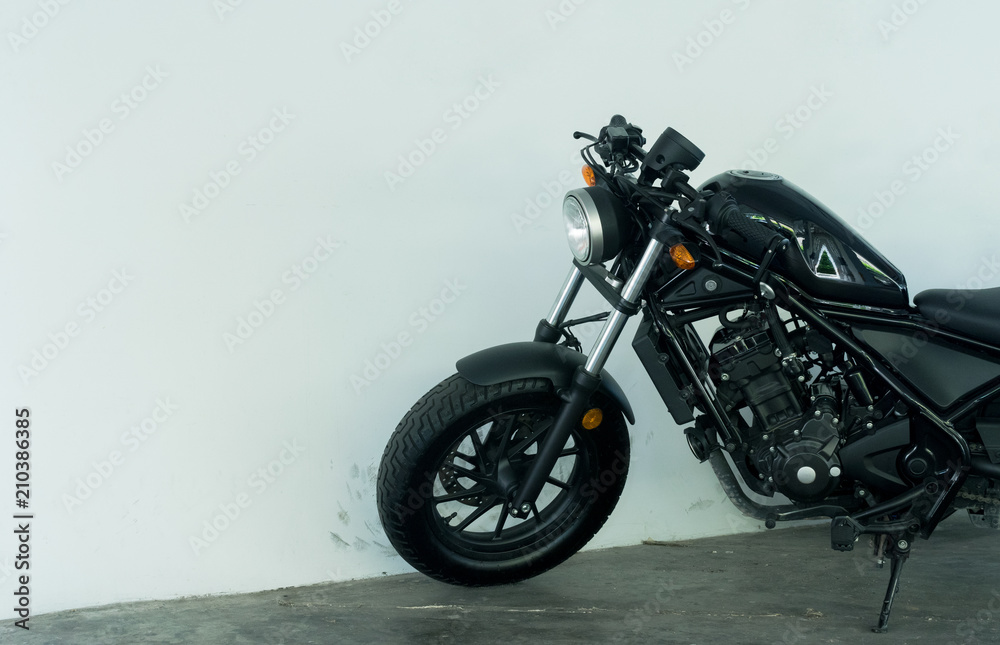 vintage motorcycle style in front of white wall background