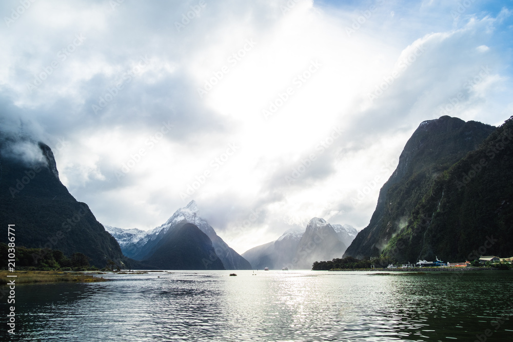 A stunning scene of nature with snow mountain and waterfalls at Milford Sound, New Zealand. A stunning scene of nature with snow mountain and waterfalls at Milford Sound, New Zealand.
