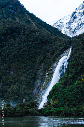 A stunning scene of nature with snow mountain and ford land at Milford Sound  New Zealand.