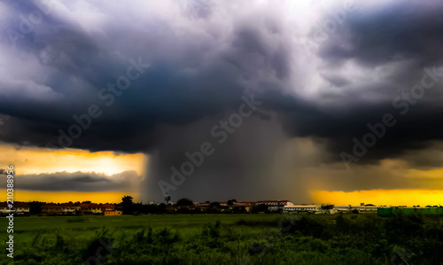 Thunderstorm, storm and thunderbolt over city in summer evening