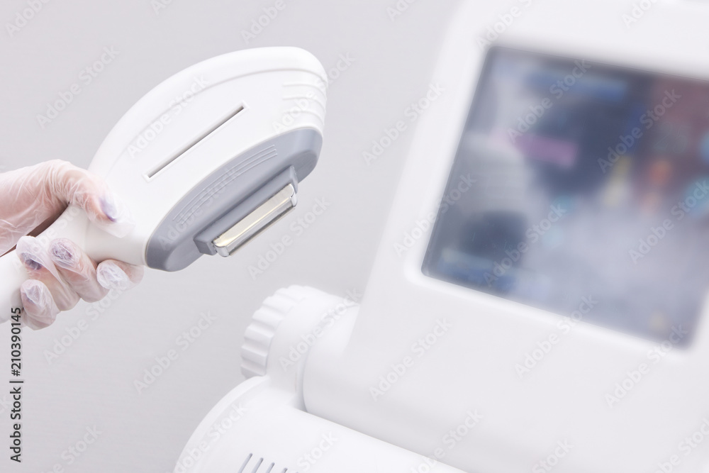 Laser hair removal. Modern equipment. Light background Laser hair removal. Modern equipment. Light background