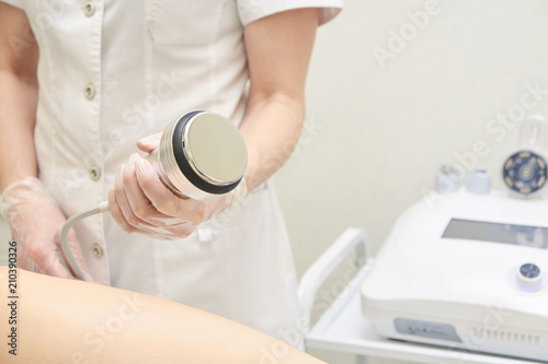 Фотография Cosmetic procedures. Modern equipment. Ultrasonic cavitation