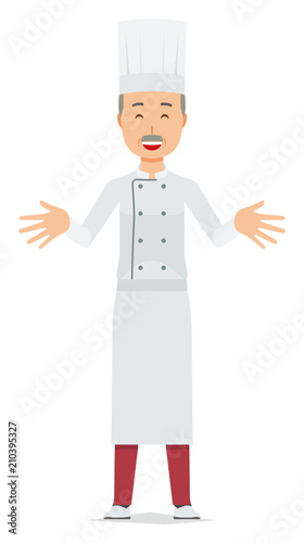 An elderly male chef wearing a cook coat is standing. And he open both hands and welcome you