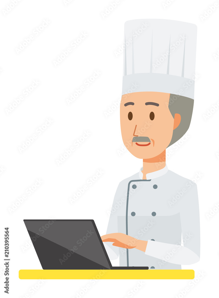 An elderly male chef wearing a cook coat is operating a laptop computer