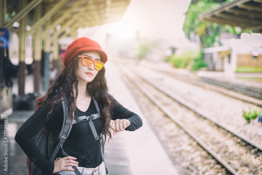 Asian woman traveler has waiting the train at Hua Lamphong station at Bangkok, Thailand. Asian woman traveler has waiting the train at Hua Lamphong station at Bangkok, Thailand.
