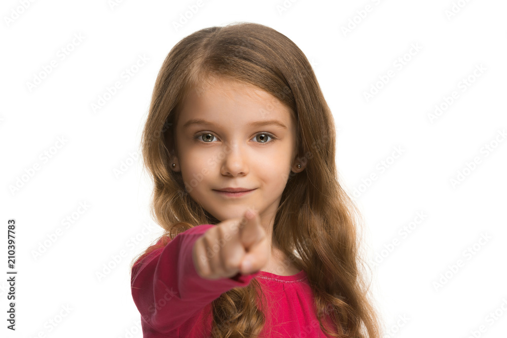 The teen girl pointing to you, half length closeup portrait on white background. The teen girl pointing to you, half length closeup portrait on white background.