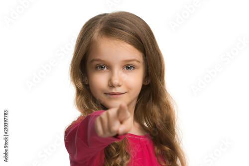 The teen girl pointing to you, half length closeup portrait on white background.