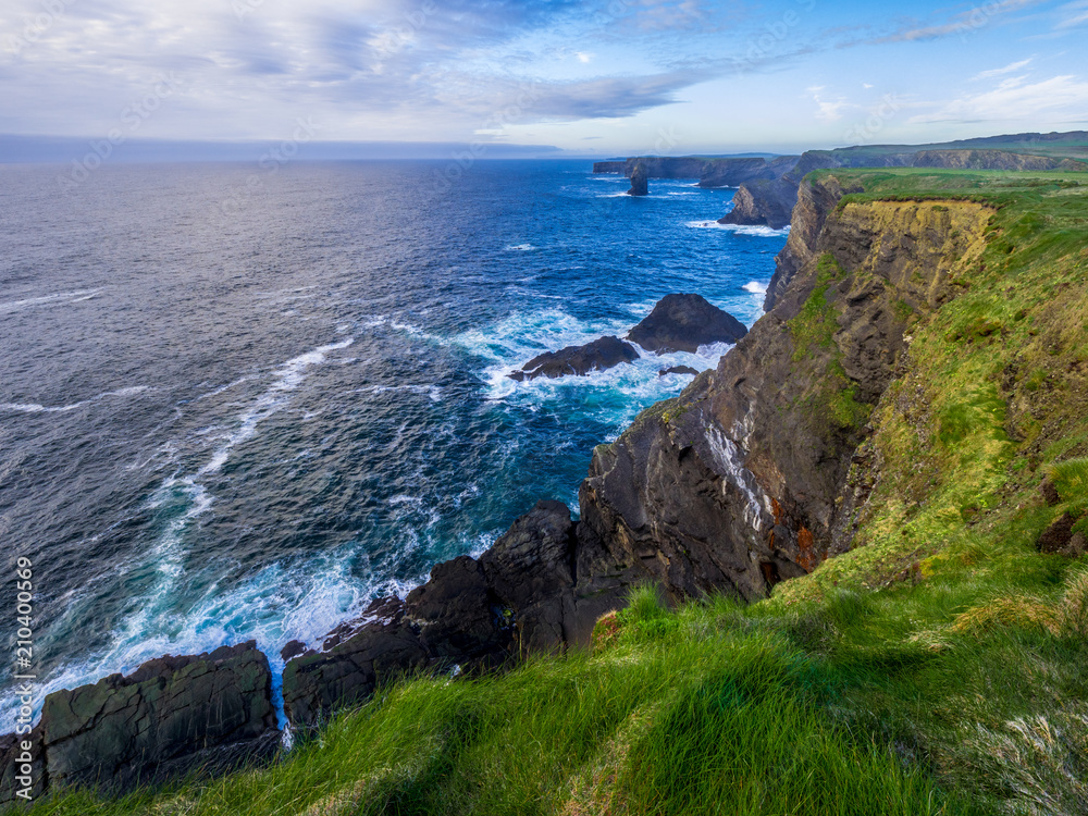Wild Atlantic Ocean - aerial view from the Cliffs of Kilkee in Ireland Wild Atlantic Ocean - aerial view from the Cliffs of Kilkee in Ireland