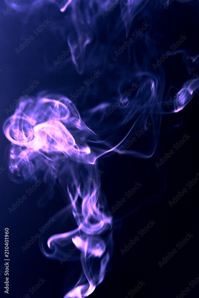 Texture of violet blue smoke clubs on a dark background. Texture of violet blue smoke clubs on a dark background.