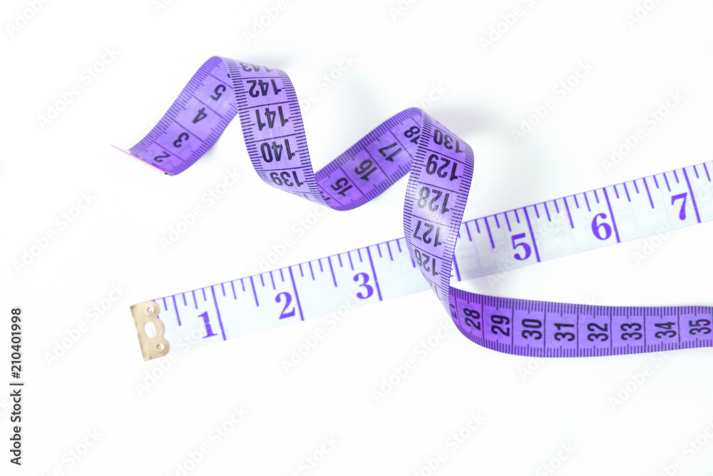 Violet measuring tape on white background. The tailor's meter isolated.  Stock Photo