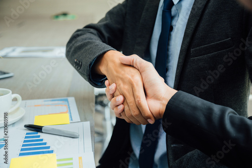 Business people shaking hands partner successful team leader and business  meeting. photo