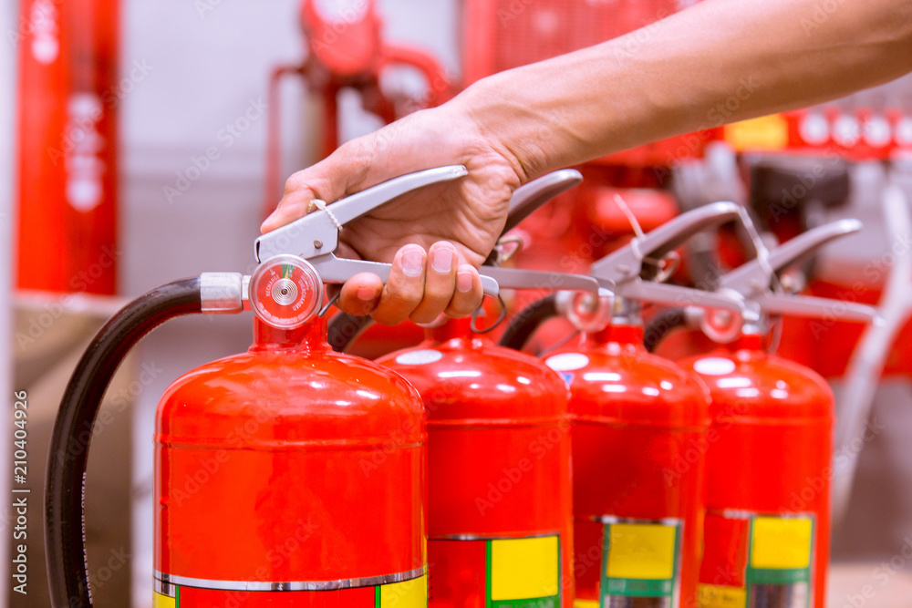 Close up Fire extinguisher and pulling pin on red tank. Close up Fire extinguisher and pulling pin on red tank.