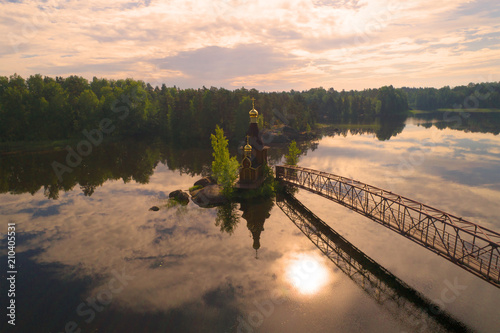 The Vuoksa River and the Church of the Apostle Andrew the First-Called in the early June morning  aerial survey . Leningrad region  Russia