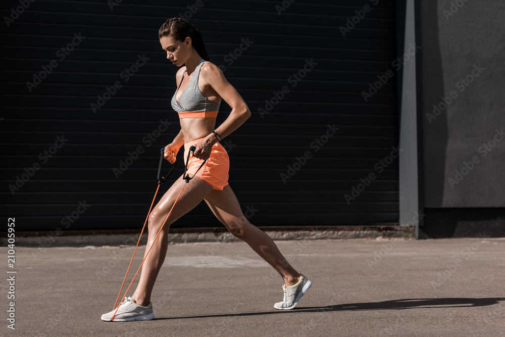 young athletic girl training with stretching band young athletic girl training with stretching band