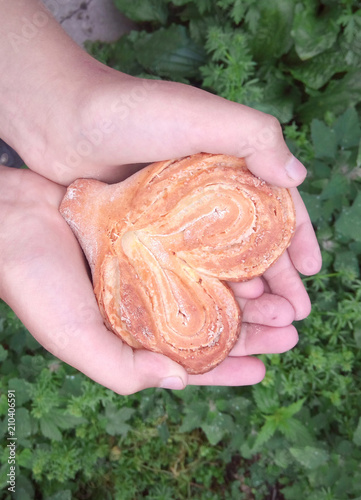 Bun in the shape of heart in the palms