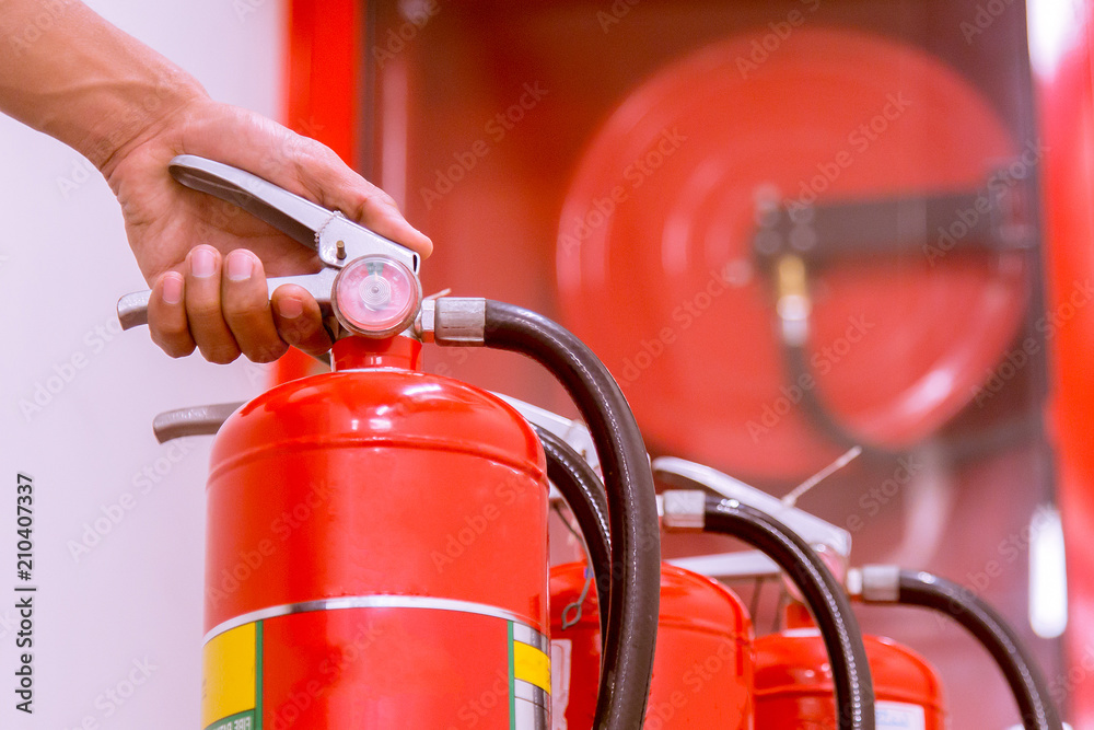Close up Fire extinguisher and pulling pin on red tank. Close up Fire extinguisher and pulling pin on red tank.