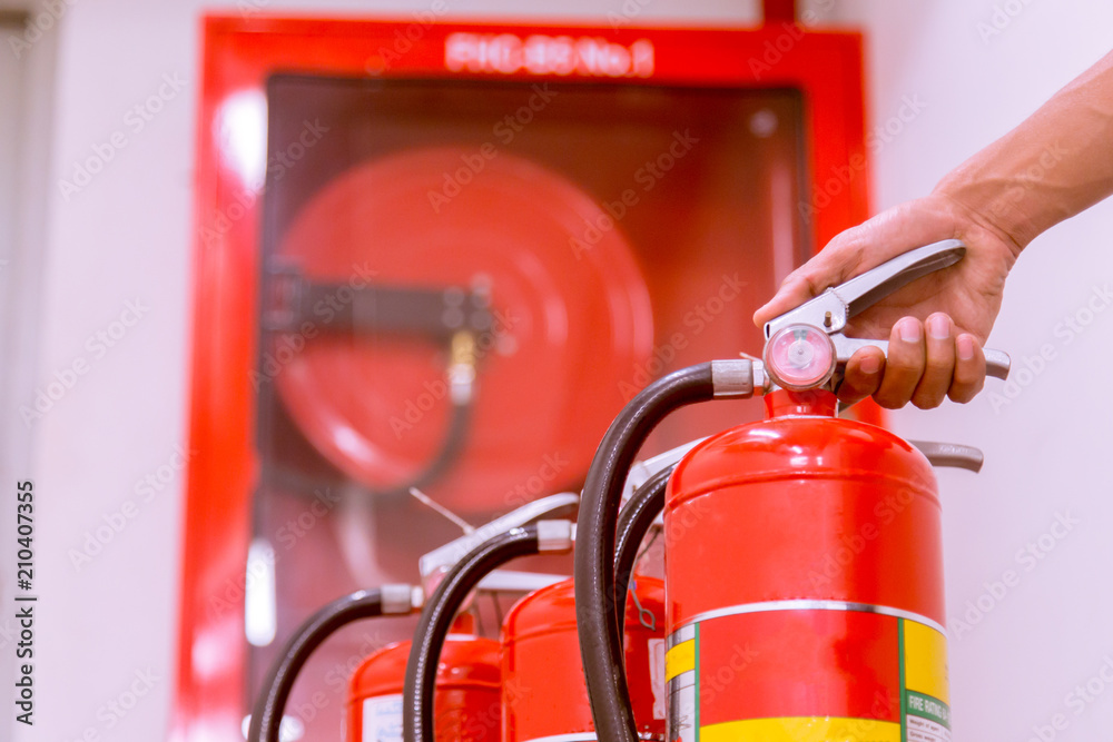 Close up Fire extinguisher and pulling pin on red tank. Close up Fire extinguisher and pulling pin on red tank.