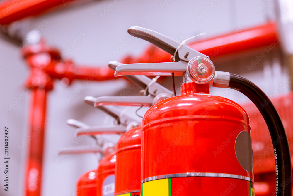 Red tank of fire extinguisher Overview of a powerful industrial fire extinguishing system.