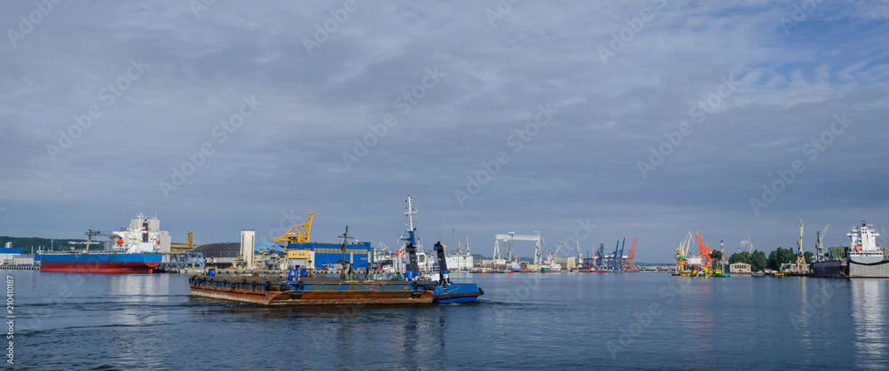 BARGE AND TUGBOAT - Morning traffic at the sea port in Gdynia BARGE AND TUGBOAT - Morning traffic at the sea port in Gdynia